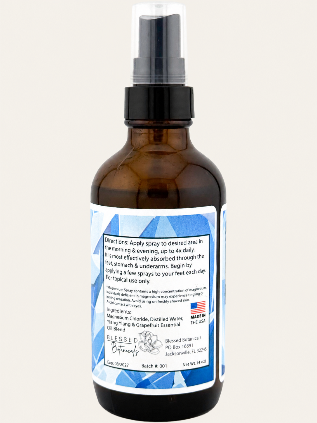 Blessed Botanicals Magnesium Spray with magnesium chloride, distilled water, and ylang ylang grapefruit essential oil blend in 4 oz amber glass spray bottle