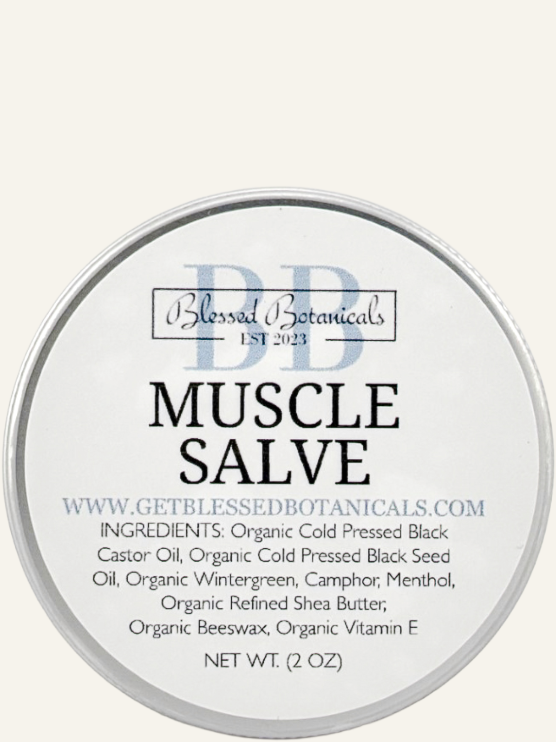 Blessed Botanicals muscle salve lid label top view showing product name and ingredients